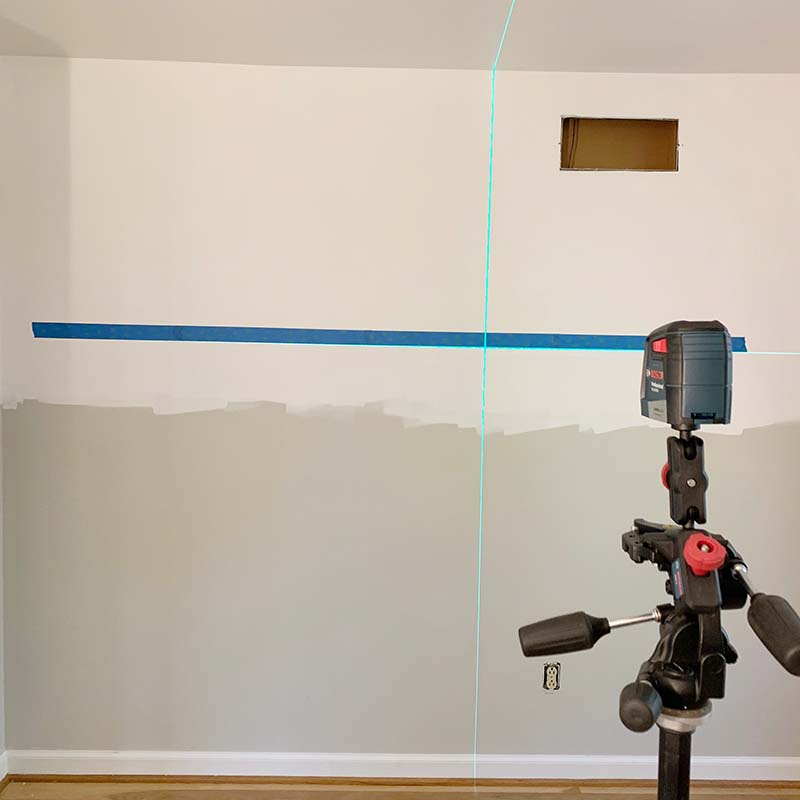 laser level used to make straight line across the wall, which is then taped