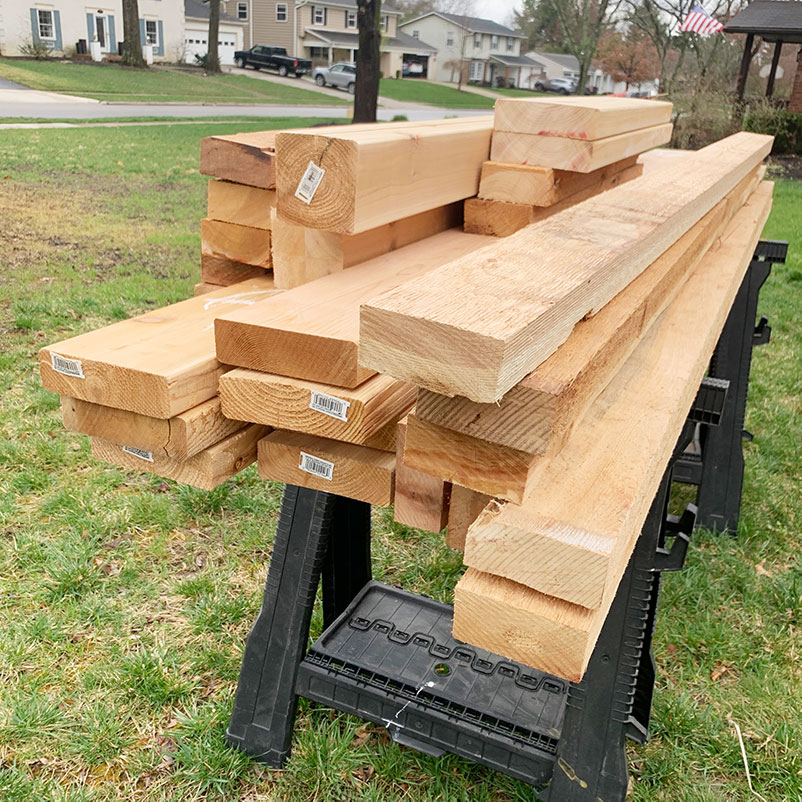 pile of cedar wood on sawhorses