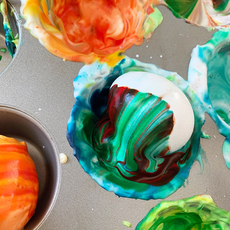 eggs swirled in shaving cream and food coloring