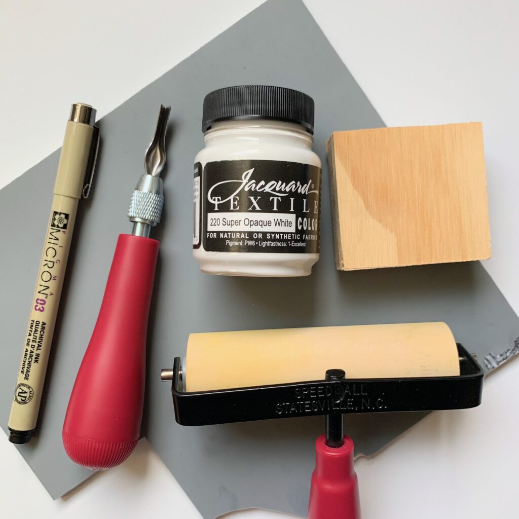 make a rubber stamp materials - includes soft-kut rubber, wood block, carving tool, marker, fabric paint, and roller